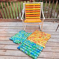 Front view of chair with yellow bars and replacement floral bars laid out