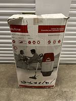 Box of NuTone VX475CC power unit with images of vacuum and accessories on the front.