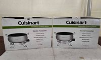 Both Cuisinart fondue set boxes front view