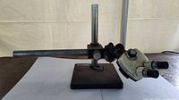 Side view of microscope on boom stand