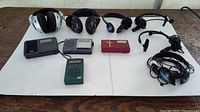 Group shot of all radios and headphones on display board