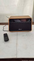 Front view of Sangean wooden tabletop radio with remote
