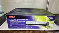 Front of box showing RCA DVD VCR combo image and branding