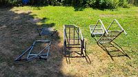 All four metal tree stand frame pieces laid out on grass