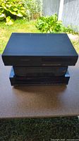 three VHS VCRs stacked front