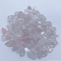 Pile of rose quartz tumbles showing overall quantity