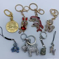 All eight keychains and charms grouped