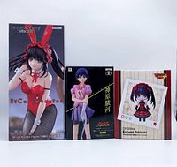 Front view of the three sealed figure boxes showing artwork and titles