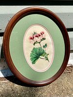 full view of framed oval floral engraving