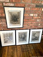 All four framed engravings displayed together