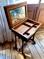 Table closed showing turned legs and stretcher