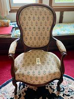 Front view of upholstered armchair
