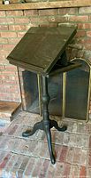 Full view of lectern angled top on brick hearth