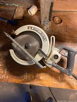Top view of circular saw showing blade guard, handles, cord