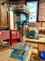 Front view of Clarke BT1000 drill press showing full unit and work table