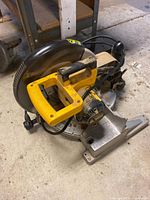 Overall view of DeWalt DW705 miter saw showing handle, base and blade