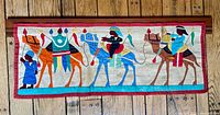 Full view of entire wall hanging showing camel caravan design