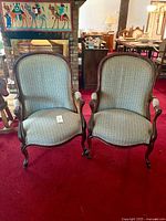 Front view of both armchairs displaying overall design and upholstery