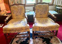 Front view of both matching toile upholstered armchairs