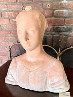 Front right perspective of terracotta female bust