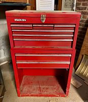 Front view of Stack-On red steel tool cabinet showing drawers and open shelf