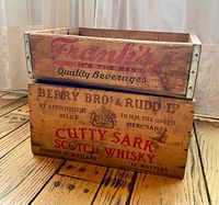 Front view of stacked crates showing Frank's and Cutty Sark branding