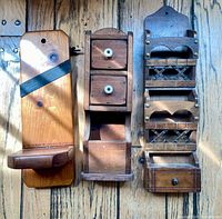 Front view of all three wooden wall shelves side by side
