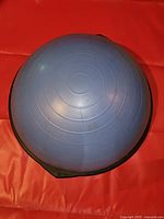 Top view of blue half exercise ball showing concentric rings