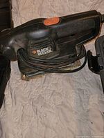 Black & Decker palm sander top view with cord