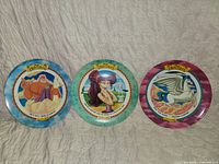 Front view of all three Disney Hercules character plates