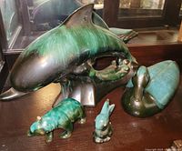 Group view of all four glazed ceramic animal figurines