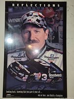Poster showing Dale Earnhardt wearing Goodwrench Service racing gear and cap with #3 Chevrolet race car graphic.