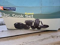 Original box showing Ozark Trail brand and 13-piece enamel cook set for service of 4 people