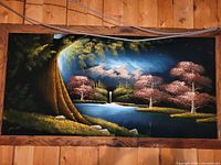 Nighttime landscape painting in wood frame