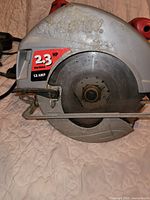 Left side view showing Skilsaw logo, 2.3 HP label and installed blade