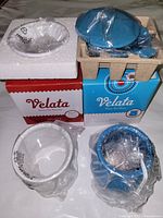 Boxes and ceramic components wrapped in plastic