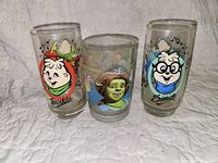 Three glasses featuring Theodore and Simon from Alvin and the Chipmunks and a Shrek character glass