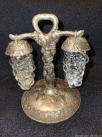 Metal grapevine stand with two hanging glass grape-cluster shakers
