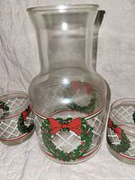 Pitcher front view with two tumblers showing wreath and lattice pattern