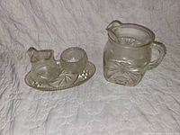 Overall view showing tray with creamer and sugar bowl, and separate water pitcher