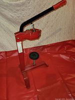 Full view of red manual corker/press