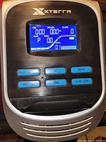 Console close-up showing XTERRA branding, display and control buttons