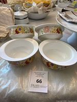Four Wedgwood bone china soup bowls arranged on a table, displaying their flower pattern and shape.