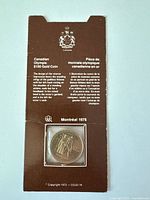 Front of sleeve showing coin reverse and text