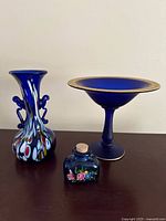 All three glass items together: footed bowl, art glass vase, painted bottle