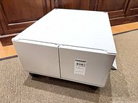 Front view showing two doors and casters