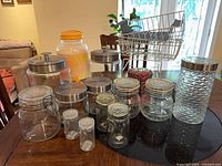 Group view of all canisters, dispenser, tin and racks