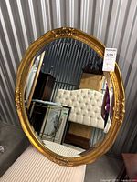 Full view of oval gilt mirror