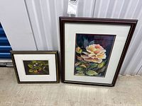 Both framed paintings side by side showing relative sizes