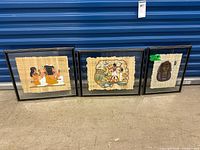 Three framed papyrus artworks side by side
